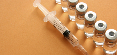 syringe and vaccine vials